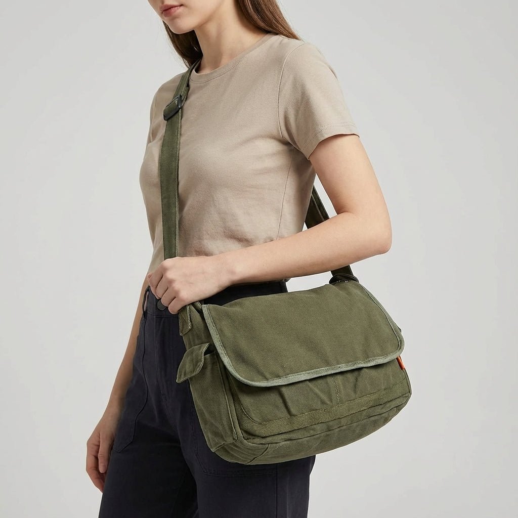 Canvas shoulder bag with adjustable strap in black, featuring a durable vintage design ideal for women. 0